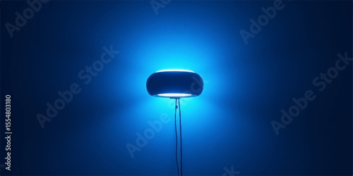 Blue streetlamp illuminating a city street with a spotlight effect on the wall