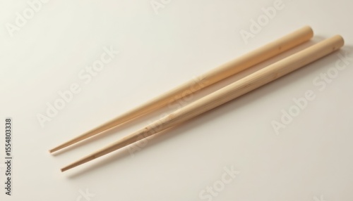 Beautifully Crafted Bamboo Chopsticks Displayed on Minimalist Background Evoking Culinary Culture and Tradition