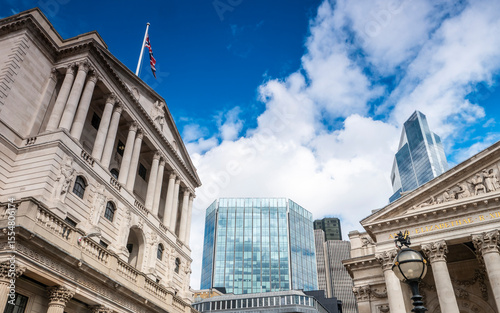 Bank of England, City of London. A low, wide angle view of the financial London landmarks with the Bank of England, left, and Royal Exchange building, right.
