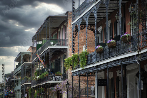 фотографія Under a brooding sky, the French Quarter’s colorful facades appear muted