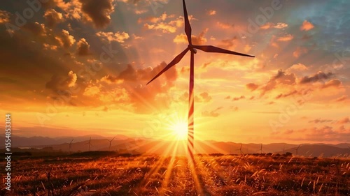 Stunning sunset over field with wind turbine silhouetted against vibrant sky, showcasing natures beauty and renewable energy in serene landscape.