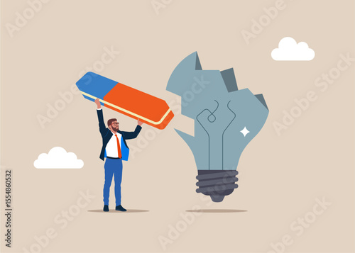 Businessman with eraser remove broken light bulb. Financial crisis and Global economic money problem. After business failure, burnout or exhausted from crisis. 