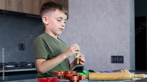 A focused child joyfully bakes colorful cookies with fun cutters and soft dough in a warm, creative kitchen