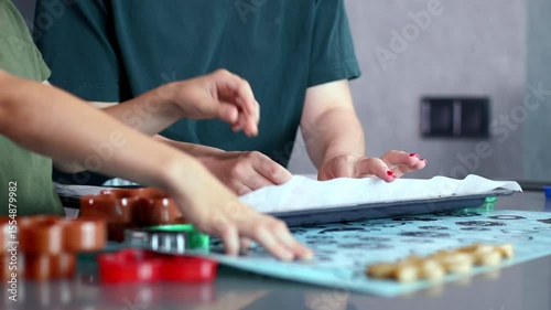 Mother and son bond over making gingerbread in their stylish kitchen.