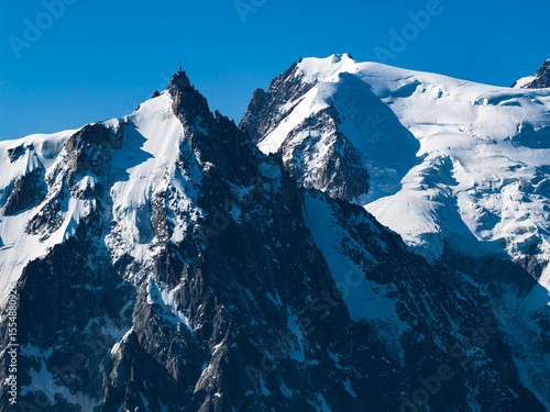 Aerial view of Glaciers cascading down the peak of  Le Mont Blanc France - Snow capped peaks on the tallest mountain in the French Alps