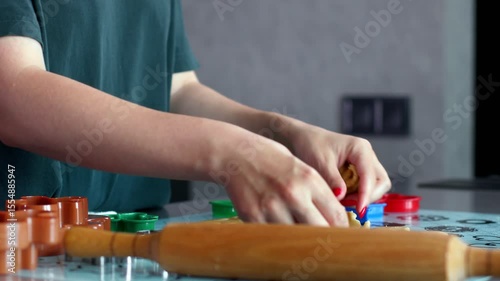 Baking Fun Rolling Out Dough using Colorful Cookie Cutters for Creative Delight and Joy.