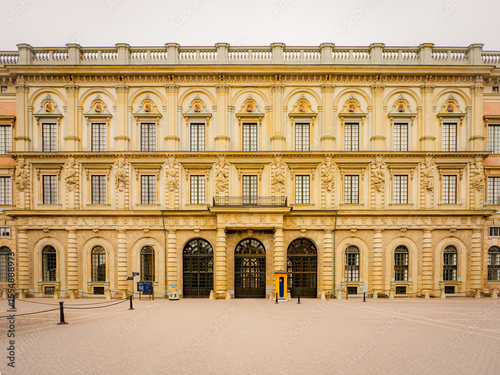 Fototapeta premium The Royal Palace in Stockholm, Sweden, stands in Baroque splendor with ornate stonework and grand symmetry—an iconic European landmark rich in royal history.
