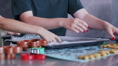 Mother and son bond over making gingerbread in their stylish kitchen.