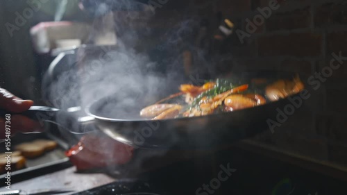 A pan of food is cooking on a stove, with steam rising from it. The steam is thick and white, and the food is orange