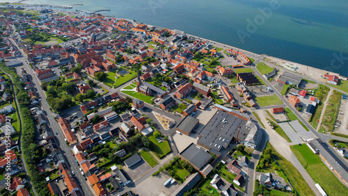 Fototapeta Naklejka Na Ścianę i Meble -  Arial panoramic view of the old town of the coast city Logstor in Denmark on a sunny spring day

