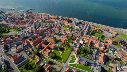 Fototapeta Naklejka Na Ścianę i Meble -  Arial panoramic view of the old town of the coast city Logstor in Denmark on a sunny spring day

