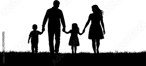 Silhouette of a family of four holding hands and walking together outdoors in silhouette