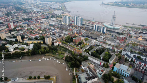Fototapeta Naklejka Na Ścianę i Meble -  Aerial panorama view above the old town of the city Bremerhaven in Germany on a late afternoon in summer	