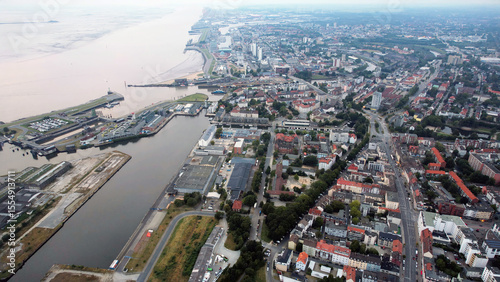 Fototapeta Naklejka Na Ścianę i Meble -  Aerial panorama view above the old town of the city Bremerhaven in Germany on a late afternoon in summer	