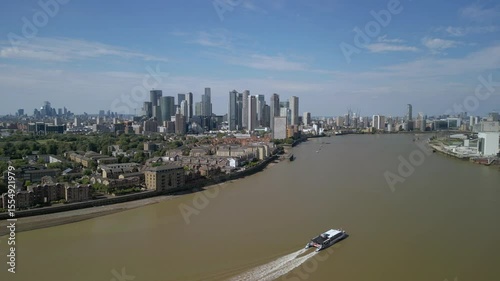 Aerial footage of the Canary Wharf business district in London. Panoramic of the skyscrapers in London. Canary Wharf is part of London's central business district.