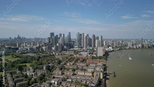 Aerial footage of the Canary Wharf business district in London. Panoramic of the skyscrapers in London. Canary Wharf is part of London's central business district.