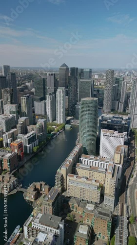Aerial footage of the Canary Wharf business district in London. Panoramic of the skyscrapers in London. Canary Wharf is part of London's central business district.