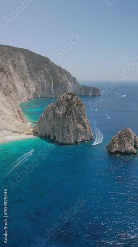 The drone aerial footage of Mizithres beach, Zakynthos Island, Greece. The two conical huge rocks, that bounce from the crystal blue waters in Keri, are called the Small and Big Mitzithra.