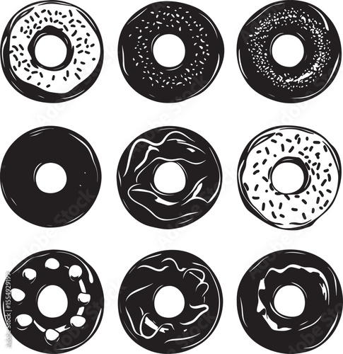 Collection of sleek black vector silhouettes of donuts