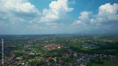 A City Aerial View Taken from Drone with Hills and Mountainous Landscape as Background