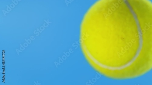 Super Slow Motion of Tennis Ball Hitting Camera on Blue Screen, 1000 fps.