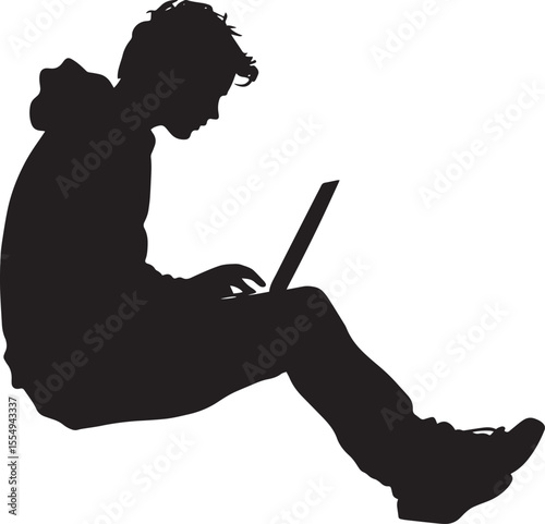 A student sitting at a desk with a laptop, typing or looking up information online.