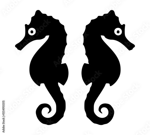 Two seahorses silhouetted against the background. This image captures the elegance of marine life. Their unique shape is clearly visible.