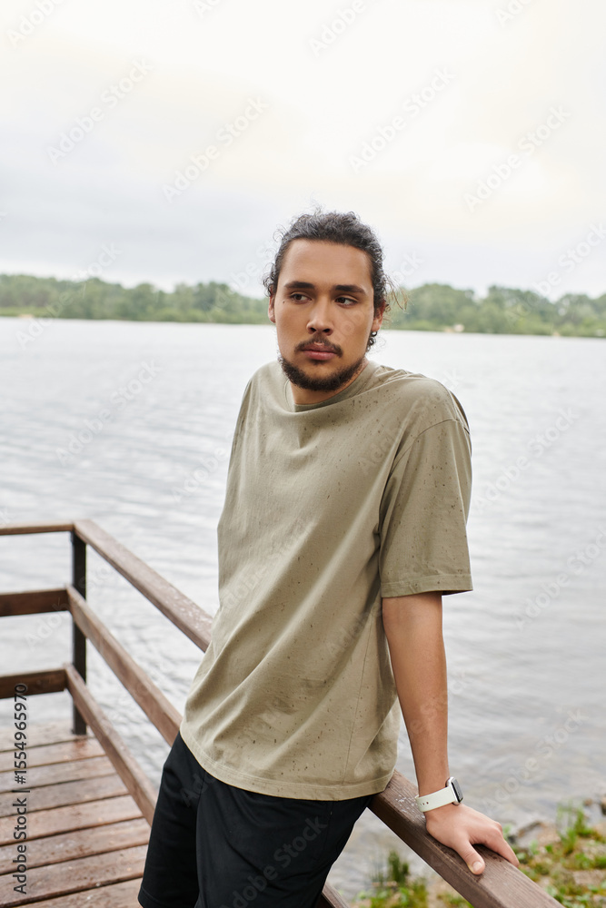 Fototapeta premium Sporty man enjoys outdoor workout by the serene lakeside in the early morning light