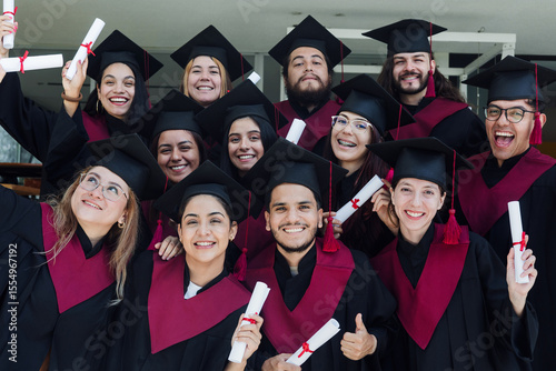 young Latin graduates students group celebrating at University campus in Mexico Latin America, portrait of hispanic people at college 