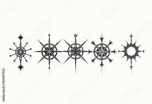 A collection of five ornate and stylized black compass rose symbols in a vintage tattoo style, perfect for navigation, adventure, and fantasy map design elements.
