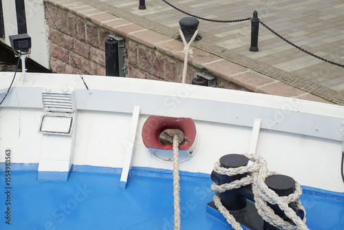 The vessel mooring line is thrown over the berth whip. Mooring of the vessel to the berth.
