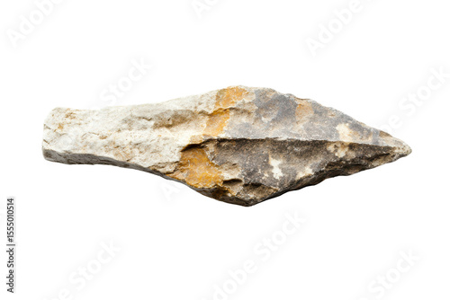 Primitive stone arrowhead showcasing detailed features from ancient craftsmanship, discovered in an archaeological site