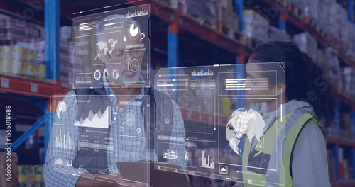 In warehouse, workers discussing data analytics on digital interface with image