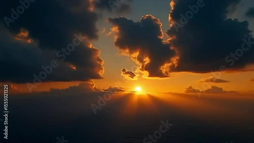 Breathtaking scenery featuring a bright and radiant golden sunrise with sunrays beaming through soft clouds