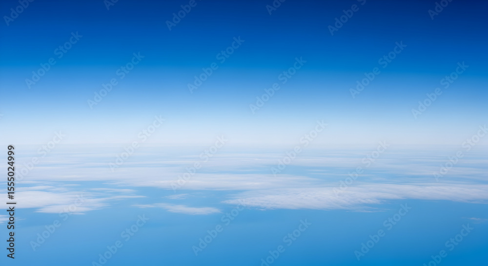 Fototapeta premium Vast and tranquil aerial perspective revealing a boundless blue sky seamlessly merging with a delicate layer of scattered white clouds on the far horizon