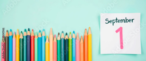 Sharpened pencils in a row with handwritten “September 1” note. Back to school.