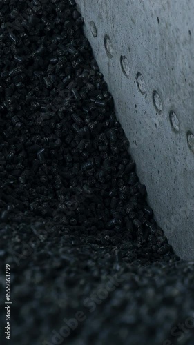 Full storage of coal in elevator storage. Dark elevator heating chemical coal. Vertical video