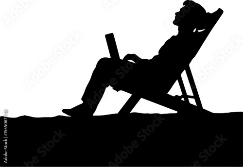 silhouette of a man sitting on a chair using laptop