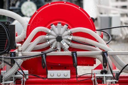 A red machine with many tubes and wires