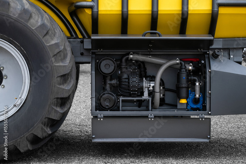 A yellow and black truck with a black engine