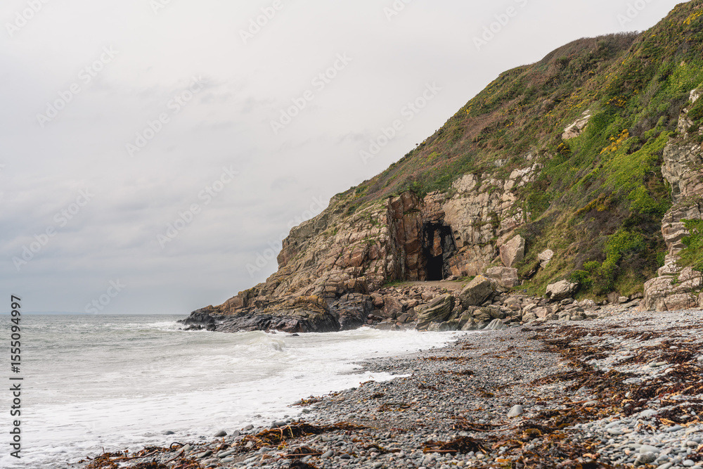 Obraz premium The Irish Sea Coast and St Ninian's Cave, Port Castle Bay, Scotland, UK