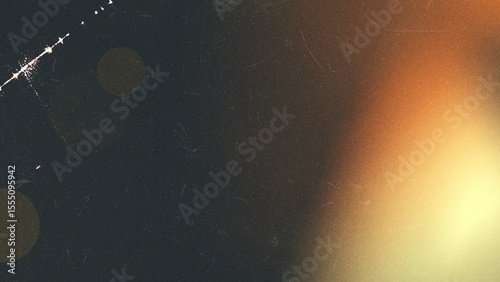 Warm light leak background with grunge texture, film grain, and dust, suitable for vintage or distressed effects