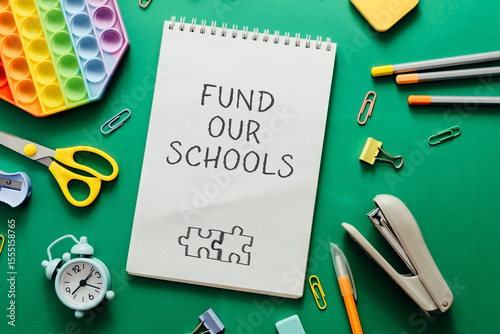 Notebook with the words fund Our Schools written on it