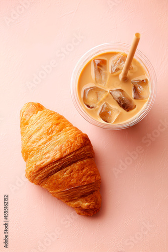 Croissant and Iced Coffee on Pink Background for Breakfast Delight