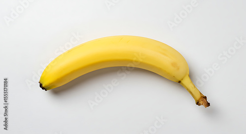Single Ripe Yellow Banana on White Background Stock Photo