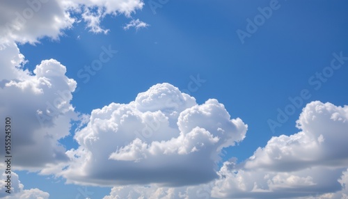 create a serene scene featuring white clouds in a blue sky on a clear day background