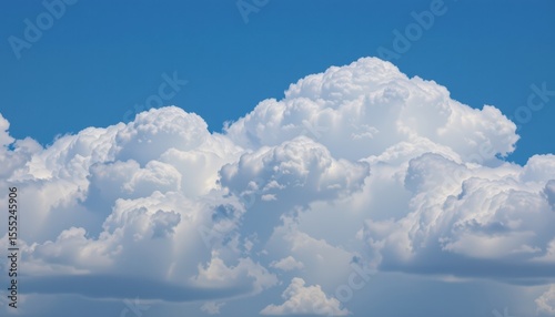 create a serene image featuring white clouds against a backdrop of blue sky on the left side, leaving plenty of space for text or other elements on the right side
