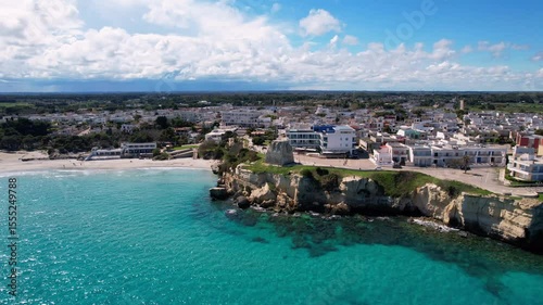 orre dell'Orso - Italy, Apulia - rotating aerial shot with panoramic view over the coastal town with its cliffs