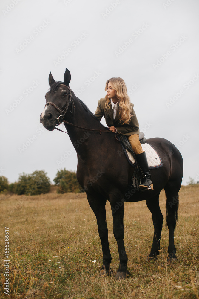 Obraz premium Woman Riding a Horse in a Serene Countryside Setting