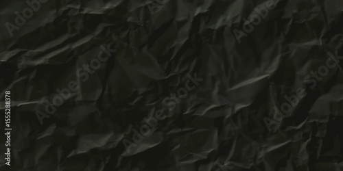 crumpled black paper texture background.  From above black crumpled paper texture. Black crumpled background.